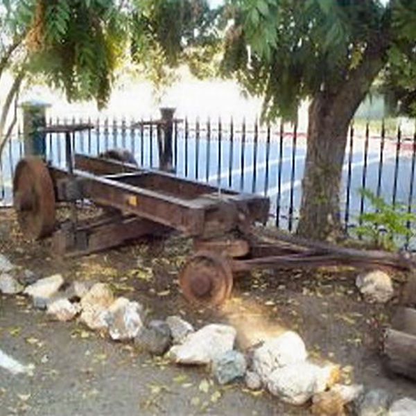Ore carts, winches, and mechanical components provide insight into the scale and complexity of mining technology. 