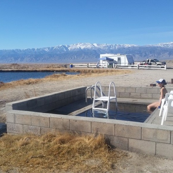 The hot springs feature a natural geothermal well that feeds into several soaking pools, with water temperature typically around 105°F (40°C). 