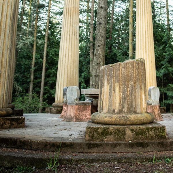 The open-air rotunda design features a central limestone table surrounded by six chairs. Each chair holds the cremated remains of a McMillin family member. 