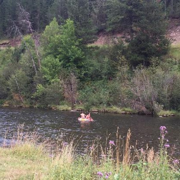Summer activities include tubing on the Fall River. 