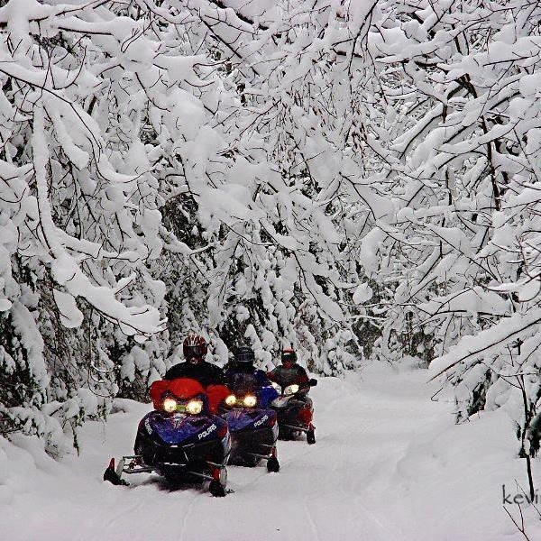 Winter in Paradise brings the fun of snowmobiles and cross-country skiing trails.