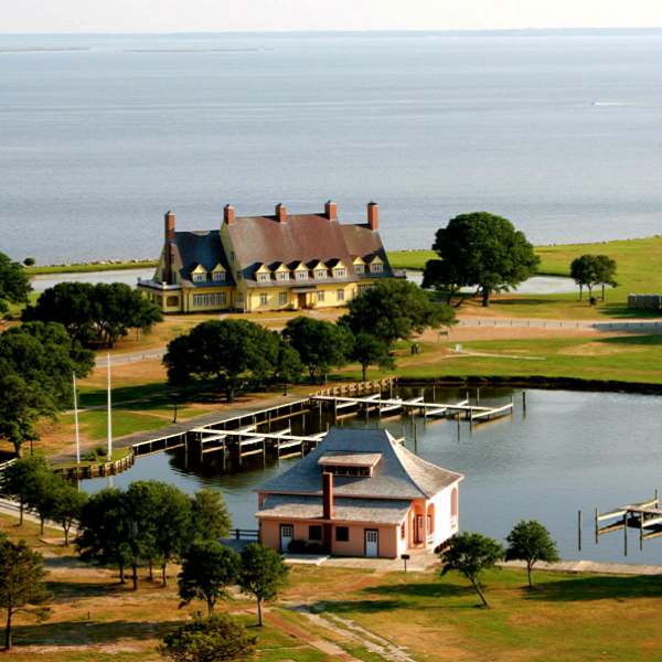 The beauty of the Outer Banks drew the wealthy to build their estates, including the Historic Whalehead Club, now a museum.