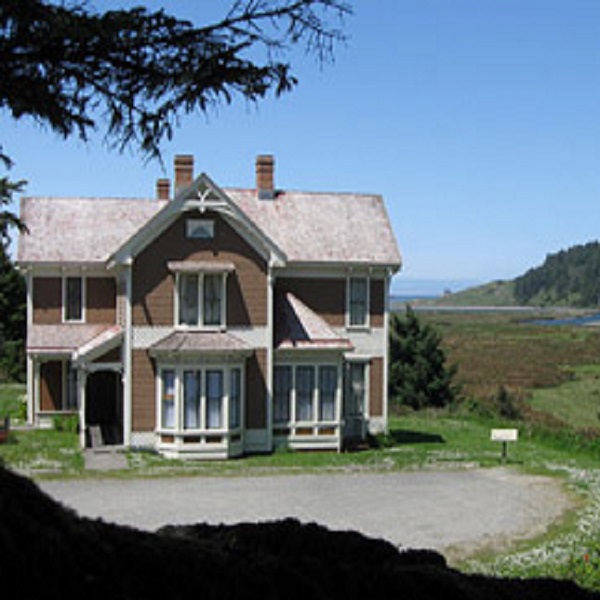 The Hughes house is on an elevated terrace with a view out to the ocean just north of Cape Blanco. 