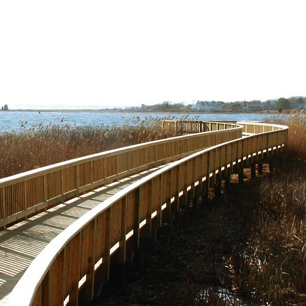 The 28-acre Claire D. McIntosh Wildlife Refuge includes a quarter-mile accessible boardwalk that winds through fresh and saltwater marshes to a majestic view of Narragansett Bay.