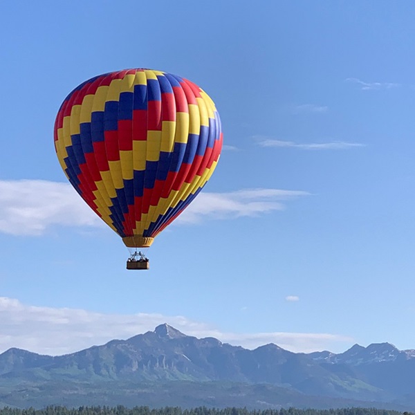 Visitors witness breathtaking panoramas of the San Juan Mountains with their snow-capped peaks, lush valleys, and shimmering lakes. 