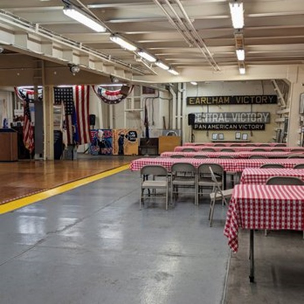 Visitors can explore the spacious holds that once carried tanks and food, peek into the crew's quarters, and stand on the bridge. 