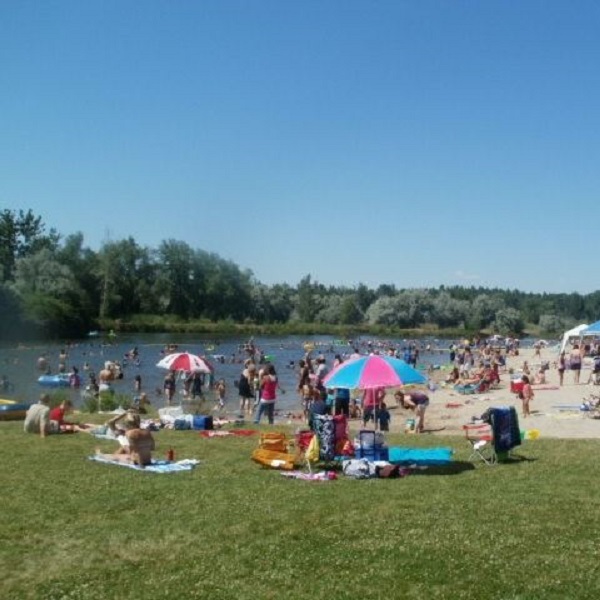 Facilities at the park include a popular swimming beach, grassy picnic area, five miles of hiking and equestrian trails, an 18-hole disc golf course, a zipline, and a waterslide. 