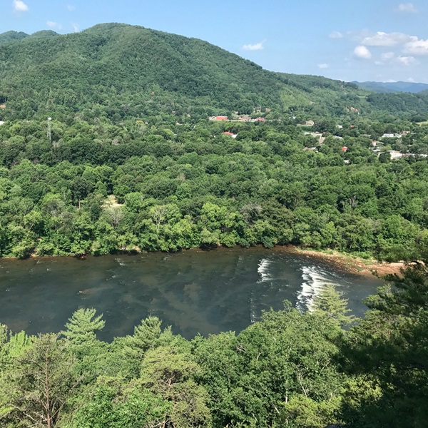 The French Broad River offers opportunities for rafting, canoeing, and kayaking, and the surrounding Pisgah National Forest provides numerous trails for hiking and mountain biking. 