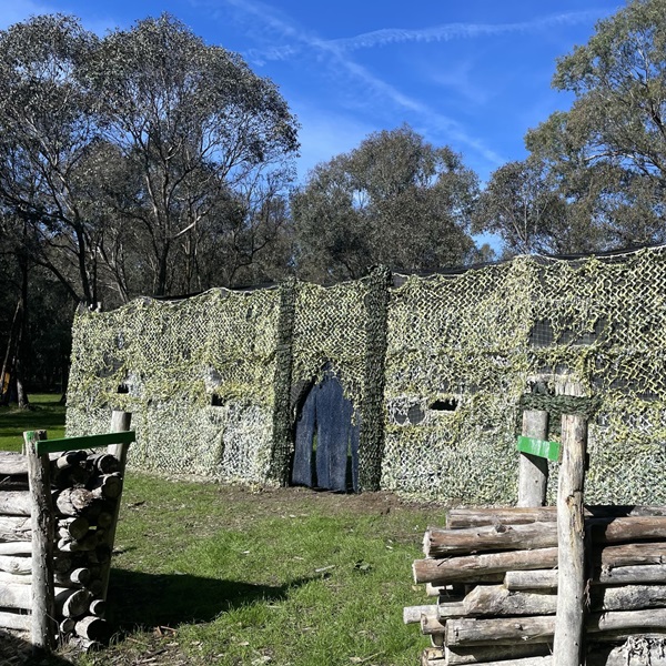 The play area includes themed arenas and realistic battle zones, enhancing the immersive experience for participants. 