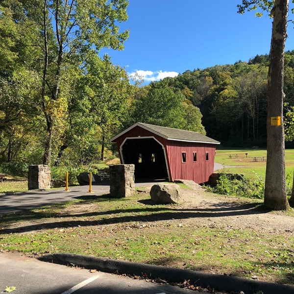 The Kent Falls Covered Bridge is a one-span Town Lattice Truss with a total length of 37 feet, an authentic reproduction built in 1974 at Kent Falls State Park. 