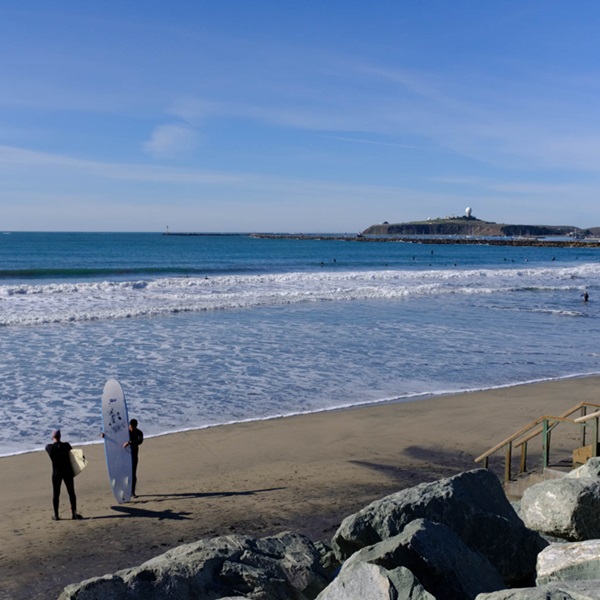 Surfers Beach is known for its consistent, manageable waves, making it an ideal spot for beginners and intermediate surfers. 