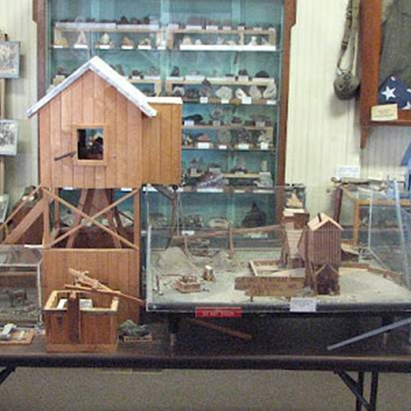 The museum features a variety of mining artifacts, including tools, machinery, and personal items used by miners. 