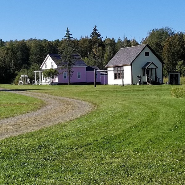 The village features a collection of historic buildings, including traditional Acadian homes, a schoolhouse, a blacksmith shop, and a chapel. 