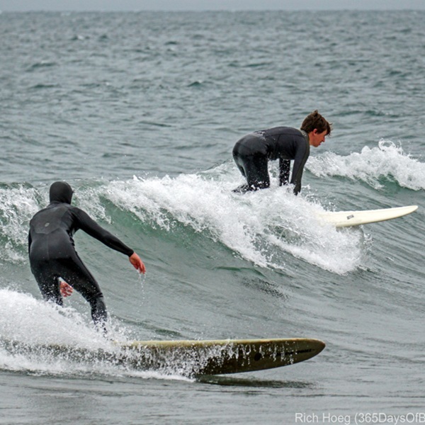 Surfing during the winter at Au Train Beach can be an intense experience for advanced surfers equipped with the right gear, offering an adventurous challenge. 