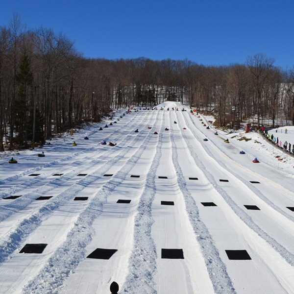 The tubing lanes are serviced by a magic carpet lift, making it a fun and accessible activity for families and visitors of all ages. 